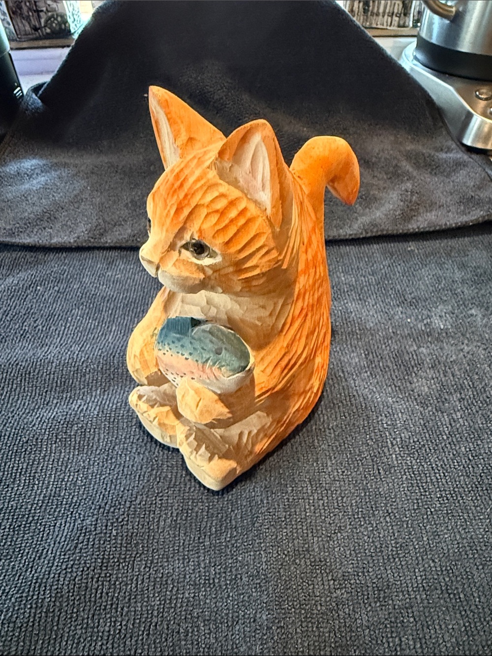 Hand-Carved Orange Cat Figurine Holding a Fish